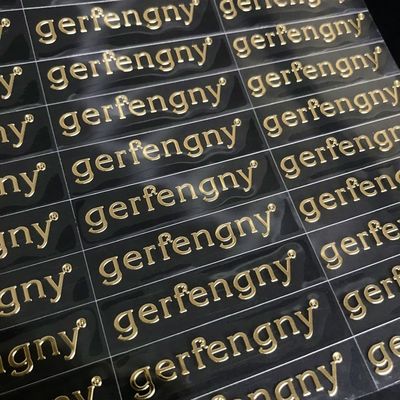 Nhãn dán chuyển nhượng logo vinyl in tùy chỉnh 3D kim loại rõ ràng Nhãn dán chuyển nhượng nhựa dán vàng nóng Nhãn dán chuyển UV