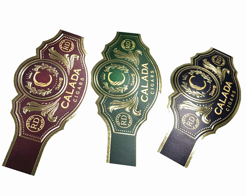 Giá tốt. Nhãn dán tùy chỉnh bán nóng Cigar Label Sticker đúc in hình dạng độc đáo UV vàng Cigar Ring Label Adhesive Waterproof Cartoon Label Printing Sticker trực tuyến